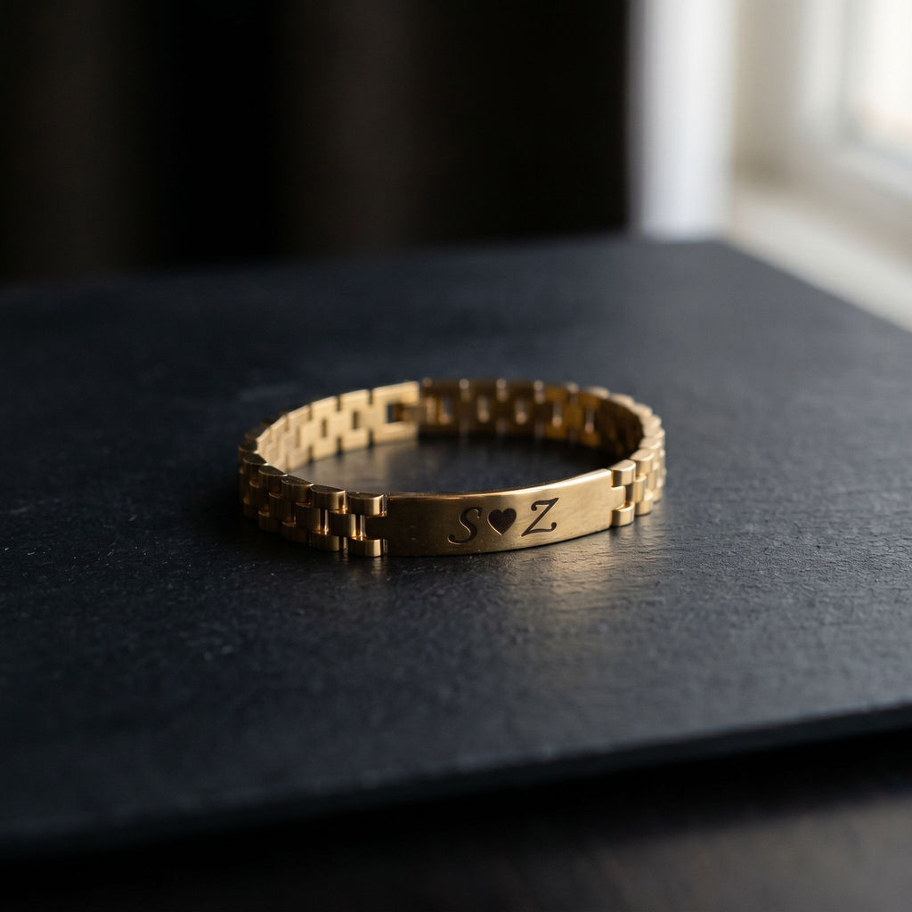 Refined engraved Rado-inspired bracelet displayed on a matte black surface with a soft light, showcasing its detailed engraving and sleek stainless steel finish.